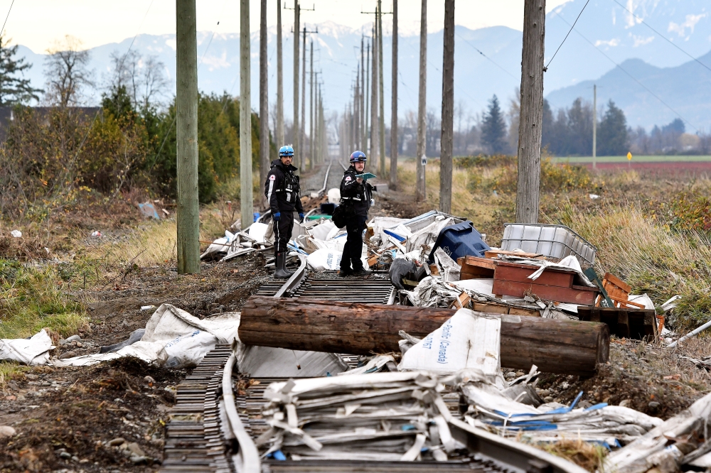 Members of theVancouver Urban Rescue Search and Rescue Canada Task Force One conduct a hazard assessment after rainstorms lashed the western Canadian province of British Columbia, triggering landslides and floods, shutting highways, in Abbottsford, British Columbia, Canada November 22, 2021. REUTERS/Jennifer Gauthier