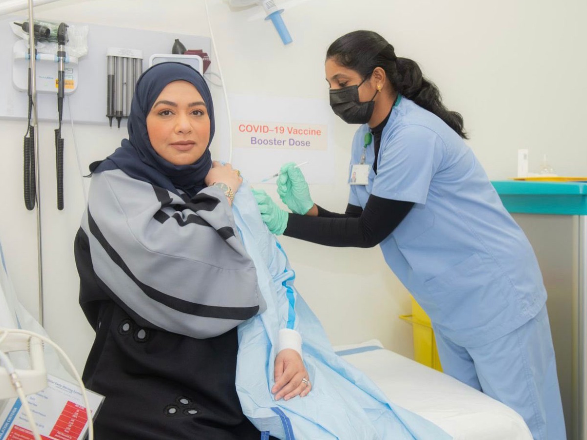Head of Vaccination at the Ministry of Public Health (MoPH), Dr. Soha Al Bayat receiving her booster dose 