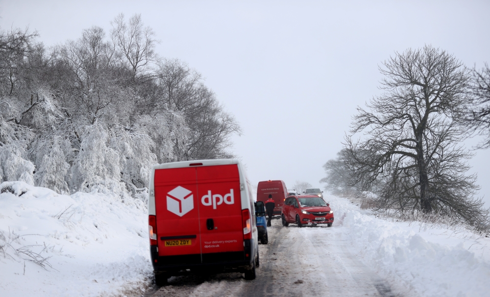 Cars are stuck in snow that fell overnight from Storm Arwen, in Leek, Staffordshire, Britain, November 27, 2021. Reuters/Carl Recine