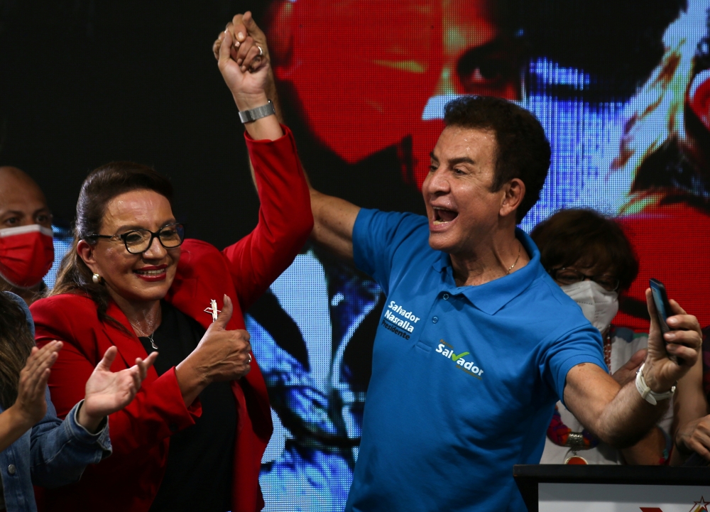 Xiomara Castro, presidential candidate of the Liberty and Refoundation Party (LIBRE), and vice presidential candidate Salvador Nasrala react after the closing of the general election in Tegucigalpa, Honduras, November 28, 2021. Reuters/Jose Cabezas