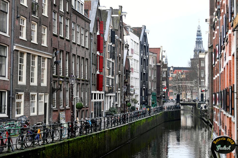 An empty street is seen during lockdown in Amsterdam, Netherlands December 15 2020, REUTERS/Piroschka van de Wouw

