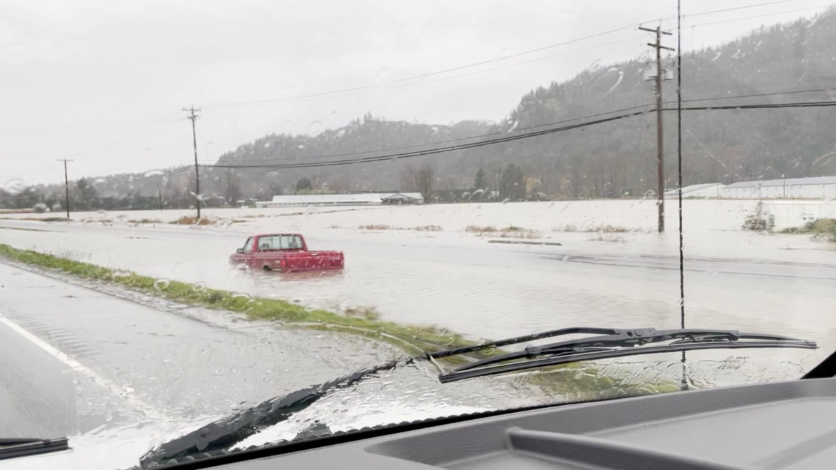 A car is submerged after rainstorms lashed the western Canadian province of British Columbia, triggering landslides and floods, shutting highways, in Abbotsford, British Columbia, Canada November 28, 2021, in this still image obtained from social media video on November 29, 2021. Courtesy of Twitter/@pnaught13/via REUTERS
