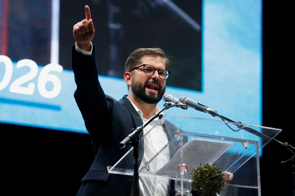 Chile's President-elect Gabriel Boric delivers a speech on stage as he celebrates with supporters after winning the presidential election in Santiago, Chile, December 19, 2021. Reuters/Rodrigo Garrido