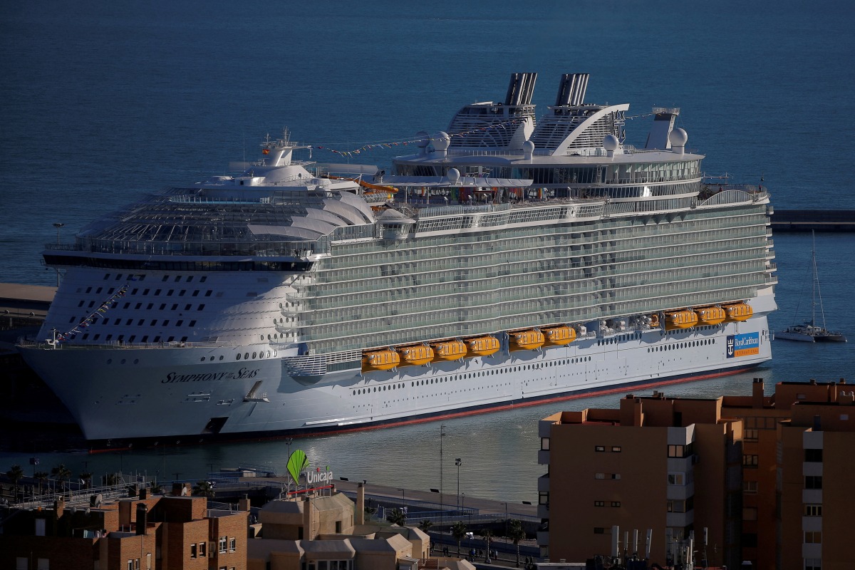 FILE PHOTO: A view of the world's largest cruise ship of Royal Caribbean Cruises, the 362-metre-long Symphony of the Seas, during its world presentation ceremony, berthed at a port in Malaga, Spain March 27, 2018. REUTERS/Jon Nazca/File Photo
