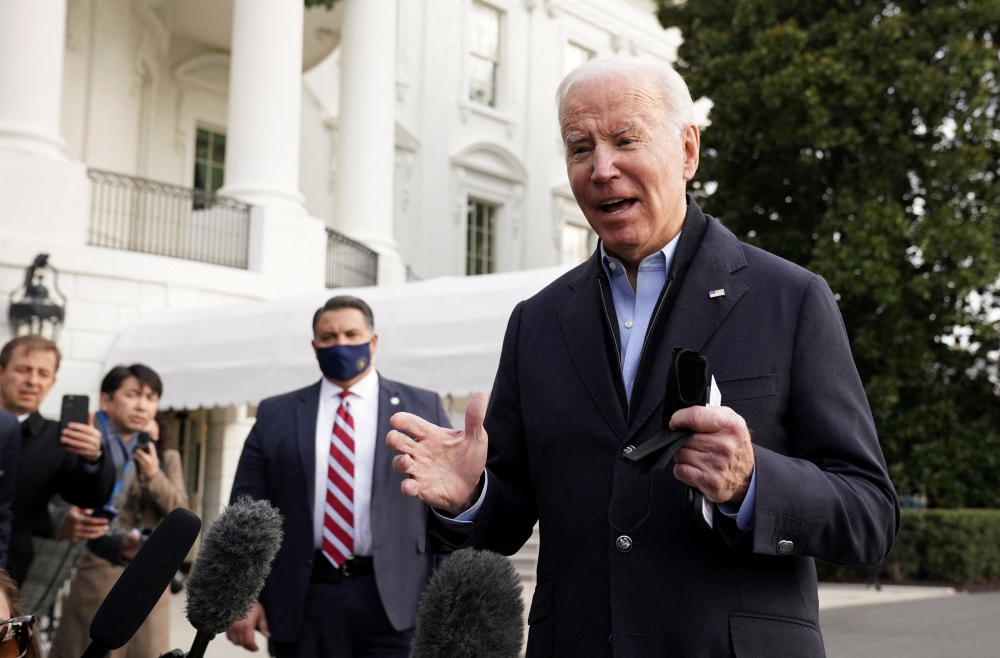 U.S. President Joe Biden speaks to reporters as he departs for tornado ravaged Kentucky from the White House in Washington, U.S., December 15, 2021. REUTERS/Kevin Lamarque/File Photo