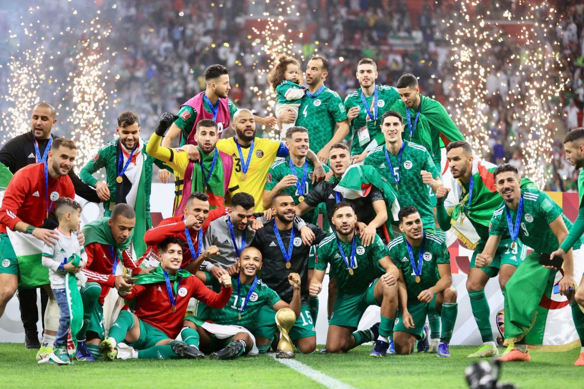 Algeria players and officials celebrate after winning the FIFA Arab Cup Qatar 2021 in this December 18, 2021 file photo.
