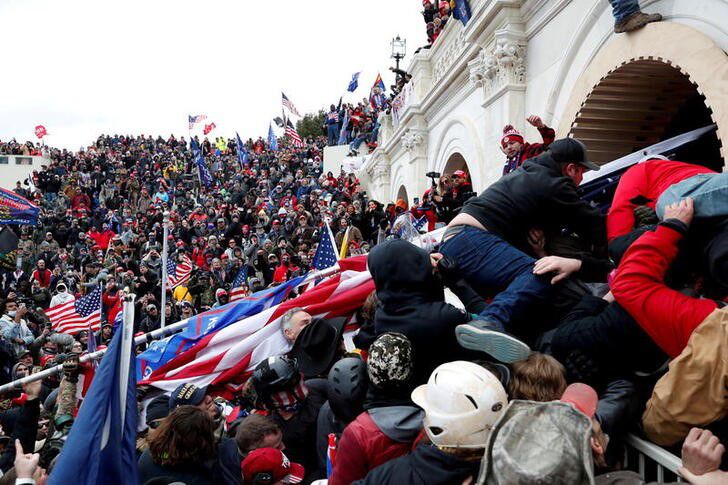 FILE PHOTO: Pro-Trump protesters storm into the U.S. Capitol during clashes with police, during a rally to contest the certification of the 2020 U.S. presidential election results by the U.S. Congress, in Washington, U.S, January 6, 2021. REUTERS/Shannon Stapleton/File Photo


