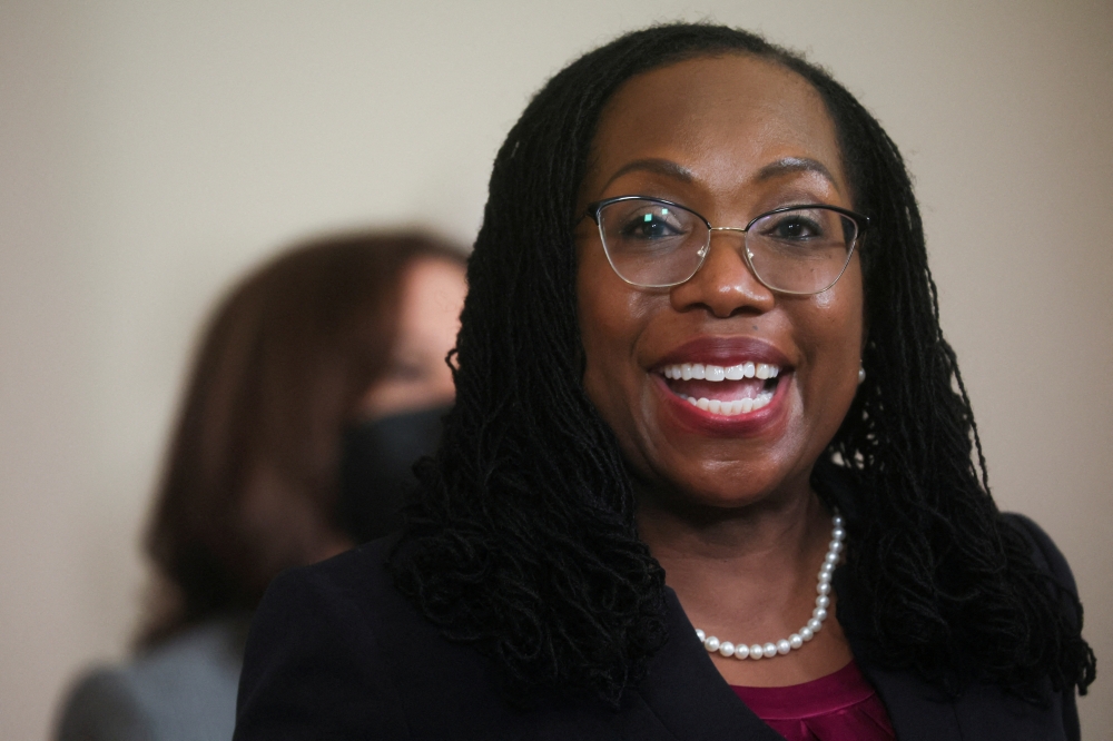 US Appeals Court Judge Ketanji Brown Jackson smiles as she accepts US President Joe Biden's nomination to be a US Supreme Court Associate Justice and the first Black woman to serve on the court, at the White House in Washington, US, February 25, 2022. Reuters/Leah Millis