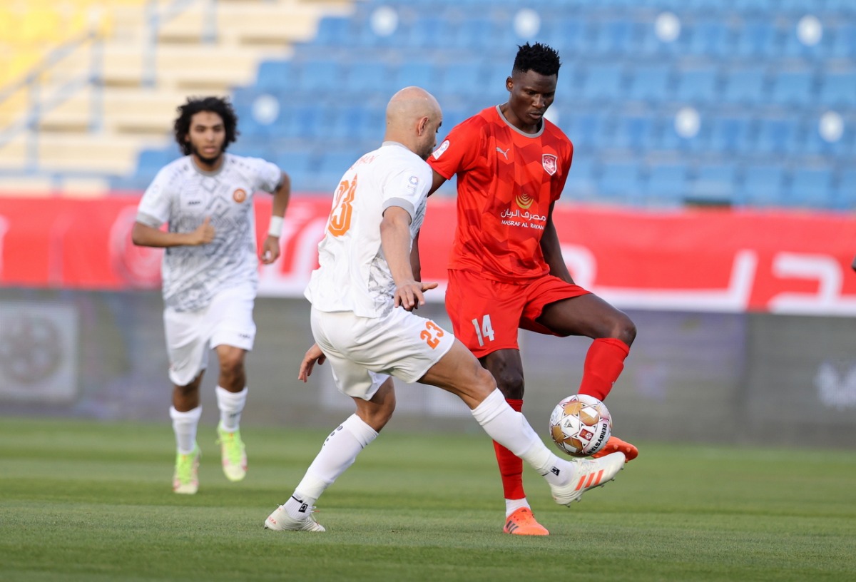 Al Duhail's Michael Olunga (right) in action against Umm Salal's Aymen Abdennour yesterday.