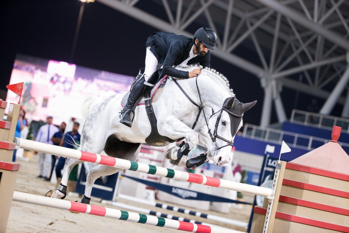 Medium Tour winner Rashid Towaim Al Marri guides Navaronne over a fence. 