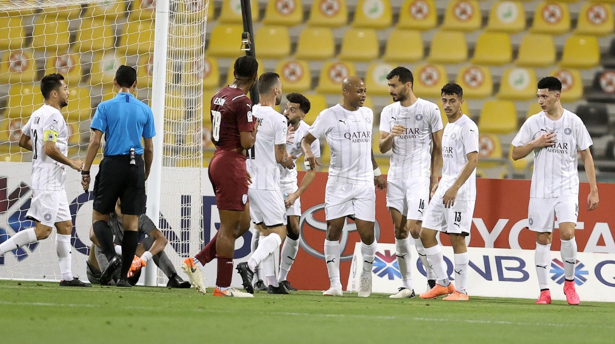 Al Sadd players celebrate after Boualem Khoukhi scored their first goal.