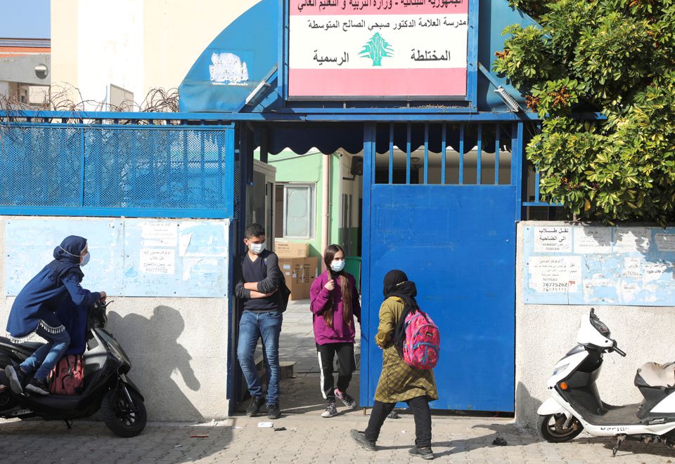 Students walk at the entrance of a public school in Beirut, Lebanon February 23, 2022. Picture taken February 23, 2022. REUTERS/Mohamed Azakir