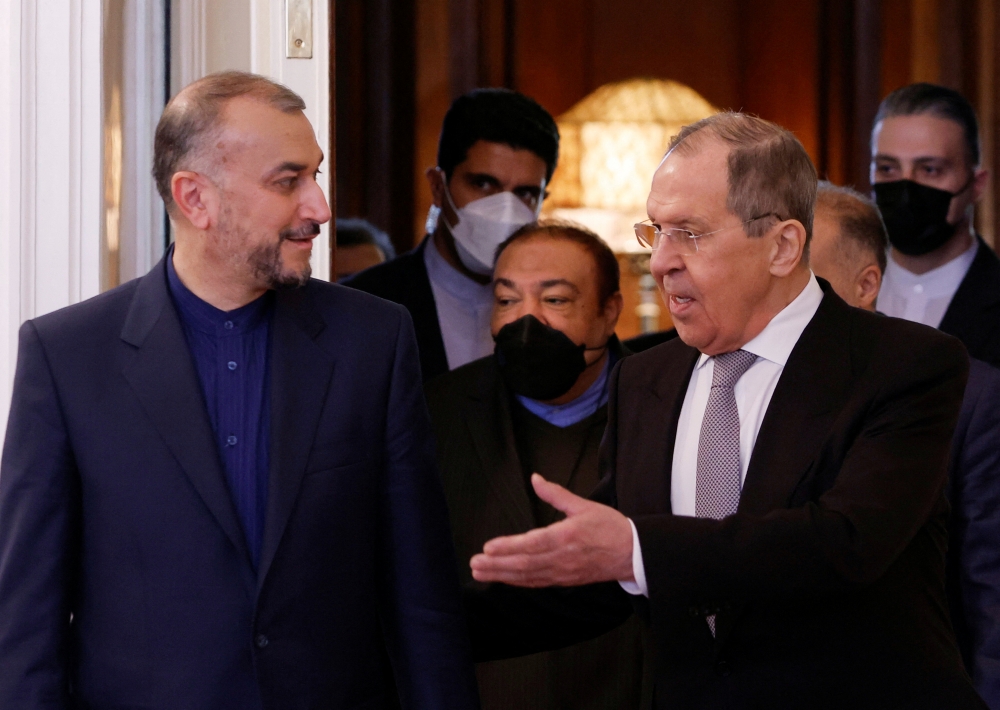 Russian Foreign Minister Sergei Lavrov and Iranian Foreign Minister Hossein Amir-Abdollahian enter a hall during a meeting in Moscow, Russia March 15, 2022. REUTERS/Maxim Shemetov/Pool