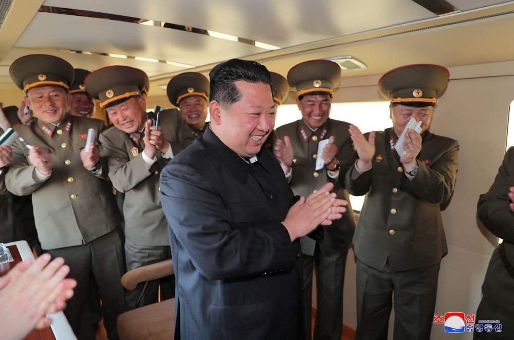 North Korean leader Kim Jong Un reacts during the test-firing of a new-type tactical guided weapon according to state media, North Korea, in this undated photo released on April 16, 2022 by North Korea's Korean Central News Agency (KCNA).