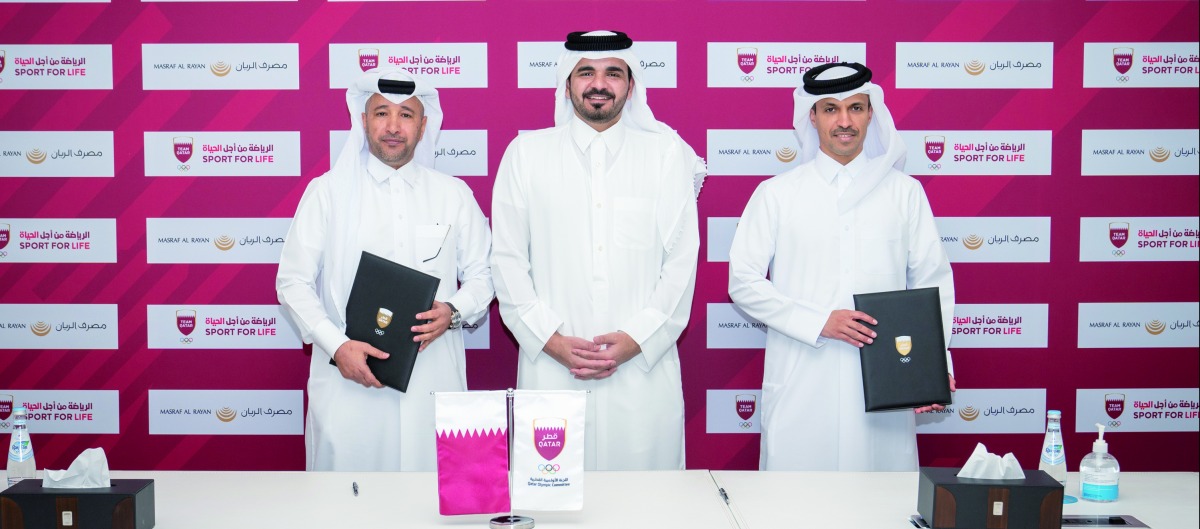 Qatar Olympic Committee (QOC) President H E Sheikh Joaan bin Hamad Al Thani, QOC Secretary-General Jassim bin Rashid Al Buenain and Masraf Al Rayan Group Chief Executive Officer Fahad bin Abdulla Al Khalifa during the agreement signing ceremony.