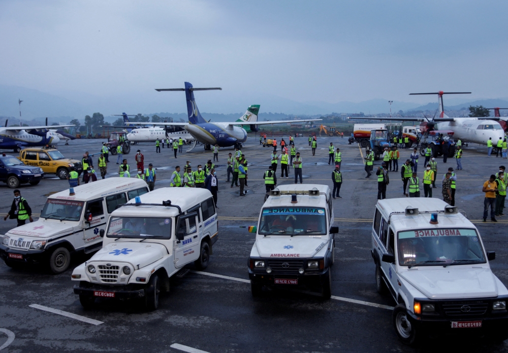 Ambulances carrying the bodies of victims of the Tara Air passenger plane, that crashed with 22 people on board while on its way to Jomsom, head towards the morgue from the airport in Kathmandu, Nepal May 30, 2022. REUTERS/Navesh Chitrakar/File Photo