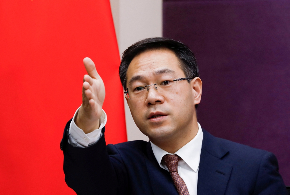 Chinese Commerce Ministry spokesman Gao Feng gestures during a news conference in Beijing, China January 29, 2021. Reuters/Tingshu Wang/File Photo