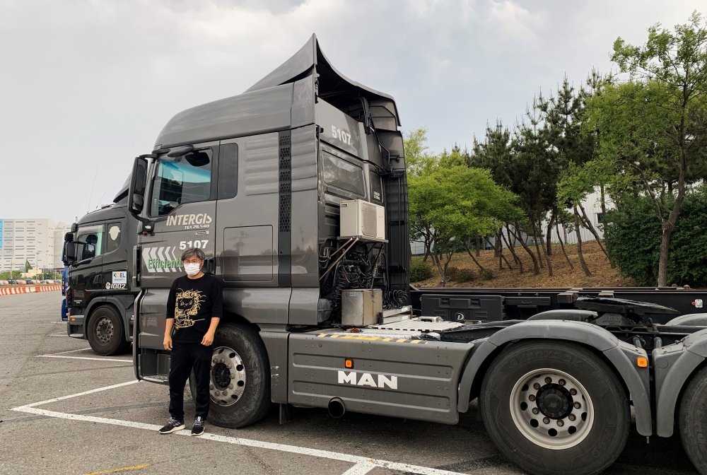 A truck driver Kang Myung-gil poses for a photograph during an interview with Reuters in Incheon, South Korea, June 10, 2022. Reuters/Ju-min Park