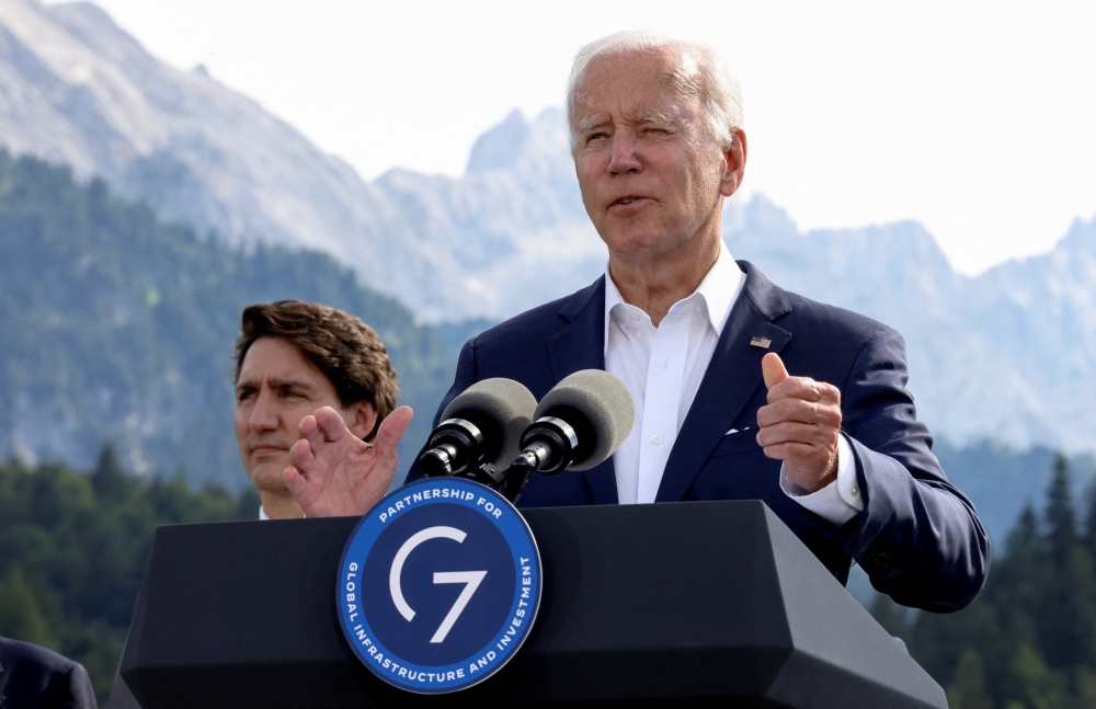 US President Joe Biden speaks next to Canadian Prime Minister Justin Trudeau during the first day of the G7 leaders' summit at Bavaria's Schloss Elmau castle, near Garmisch-Partenkirchen, Germany, on June 26, 2022. (Reuters/Lukas Barth)
