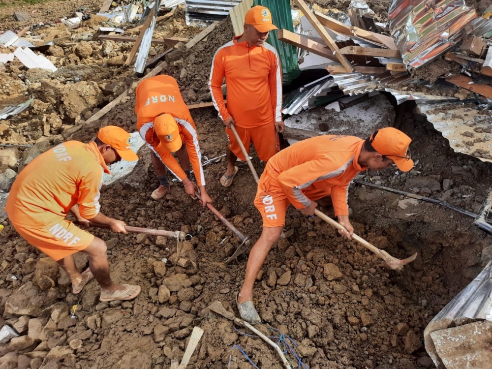 Members of National Disaster Response Force search for survivors after a landslide in Noney in the northeastern state of Manipur, India, on June 30, 2022. (Reuters)

