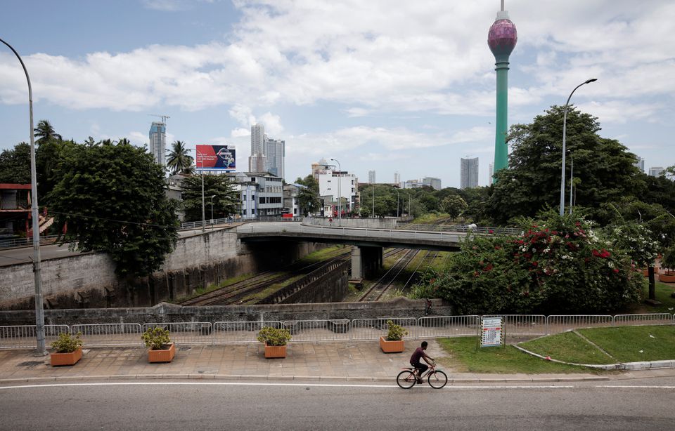 A man rides a cycle along main road as less vehicles are on the road due to fuel shortage, amid the country's economic crisis, in Colombo, Sri Lanka, June 28, 2022. REUTERS/Dinuka Liyanawatte


