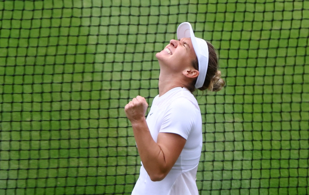Romania's Simona Halep celebrates winning her quarter final match against Amanda Anisimova of the U.S. REUTERS/Hannah Mckay
