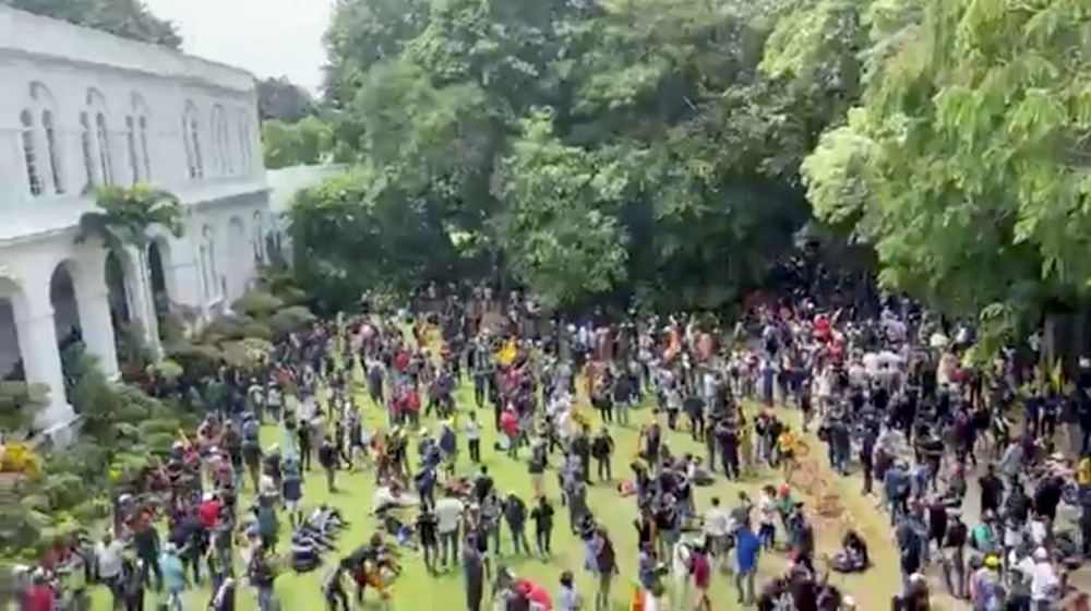 Demonstrators protest inside the President's House, after President Gotabaya Rajapaksa fled, amid the country's economic crisis, in Colombo, Sri Lanka, in this screengrab obtained from social media video on July 9, 2022. (Reuters)