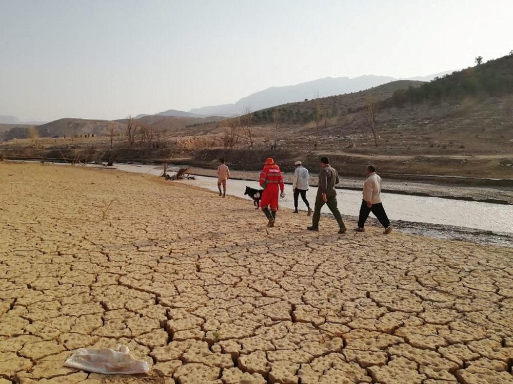Rescuers work following the flood in Estahban county in southern Iran July 23, 2022. Iranian Red Crescent Society/WANA (West Asia News Agency)/Handout via REUTERS ATTENTION EDITORS - THIS IMAGE HAS BEEN SUPPLIED BY A THIRD PARTY.