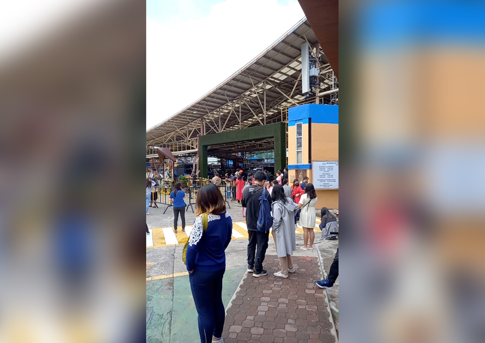 Crowds of people stand on the side of the road, following an earthquake in Baguio City, Philippines July 27, 2022 in this screen grab obtained from social media video. Clarence Bantog/via REUTERS