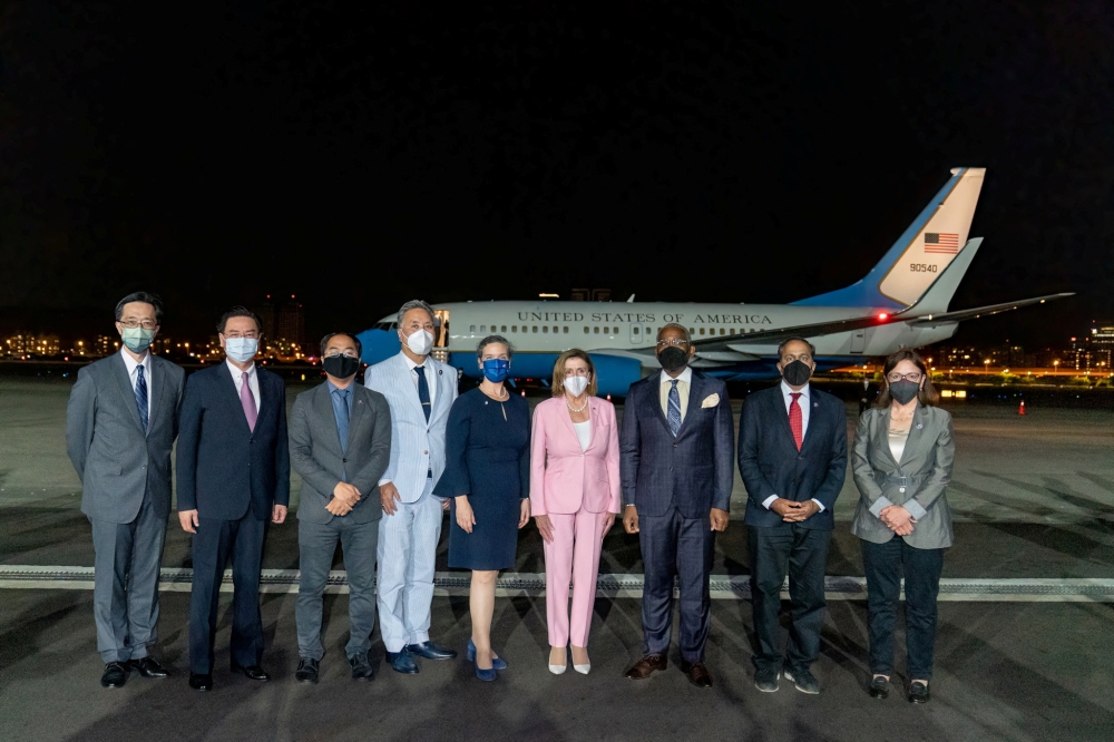 Taiwan Foreign Minister Joseph Wu with US House of Representatives Speaker Nancy Pelosi, American Institute in Taiwan Director Sandra Oudkirk and other members of the delegation at Taipei Songshan Airport in Taipei, Taiwan, August 2, 2022. (Taiwan Ministry of Foreign Affairs/Handout via REUTERS)