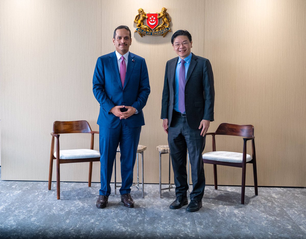 Deputy Prime Minister and Minister of Foreign Affairs H E Sheikh Mohammed bin Abdulrahman Al Thani with Deputy Prime Minister and Minister for Finance of Singapore, H E Lawrence Wong, in Singapore, yesterday.
