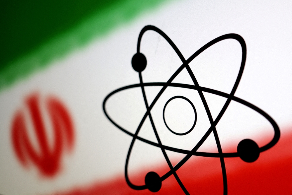 The atomic symbol and the Iranian flag are seen in this illustration, July 21, 2022. REUTERS/Dado Ruvic/Illustration//File Photo
 