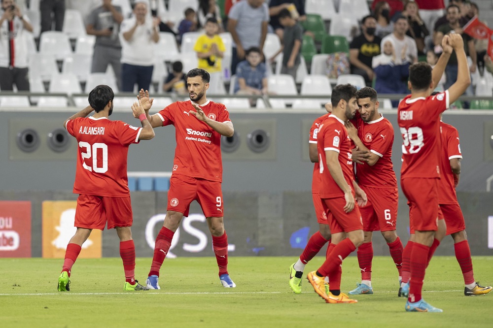 Al Arabi players celebrate during the match against Al Markhiya.  