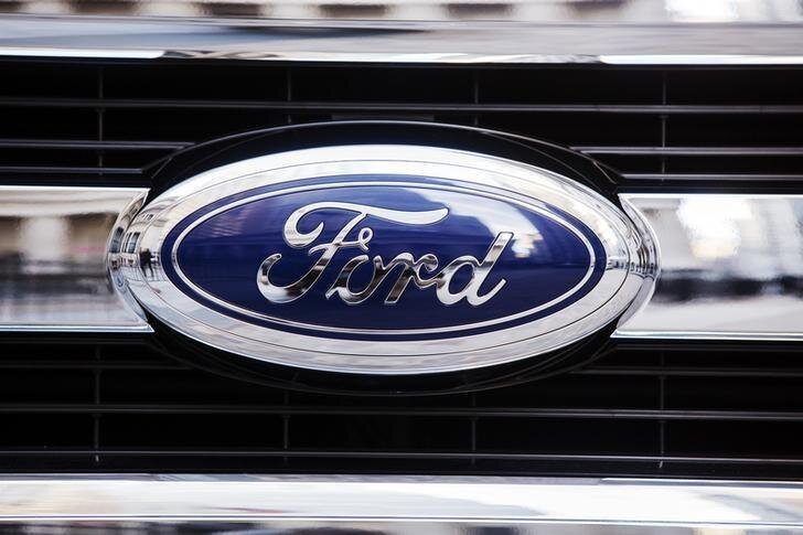 A Ford logo is seen on the grill of a 2015 F-150 truck outside the New York Stock Exchange in the Manhattan borough of New York, January 13, 2014. REUTERS/Lucas Jackson