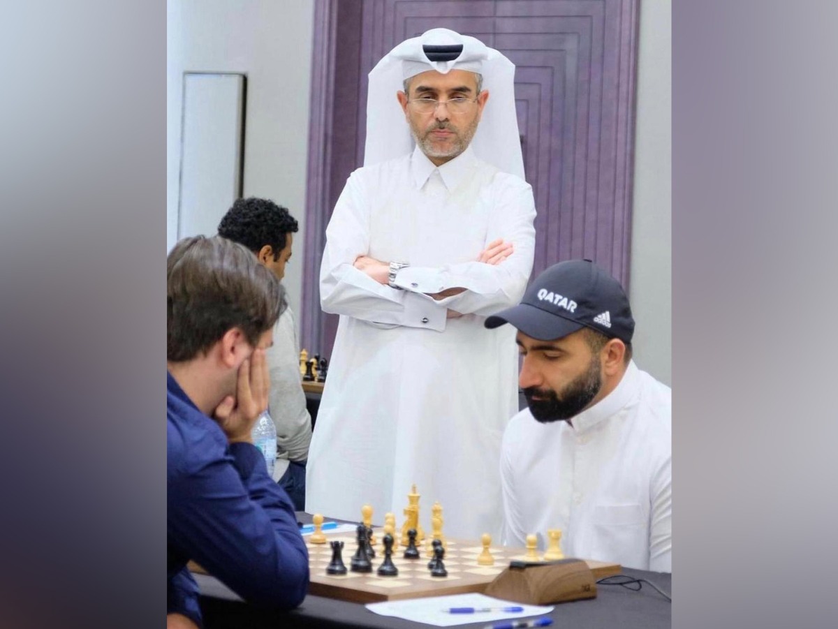 Qatar's Hussein Aziz (right) during his match.