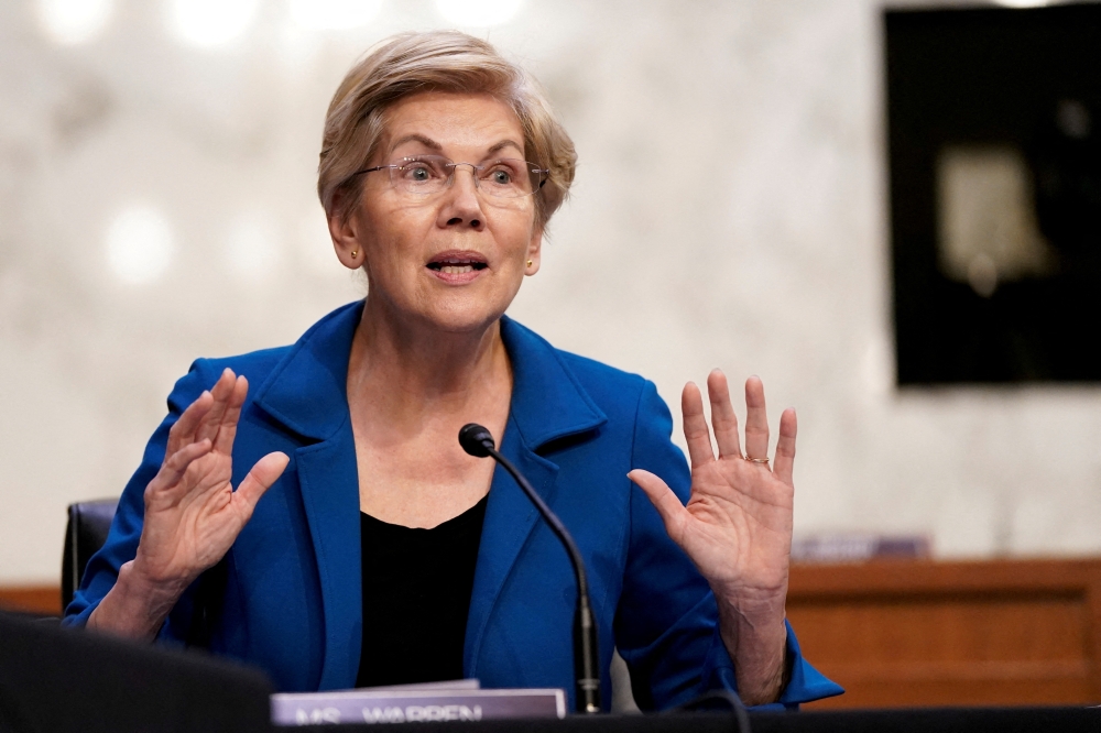 US Senator Elizabeth Warren (D-MA) gestures as Federal Reserve Chair Jerome Powell testifies before a Senate Banking, Housing, and Urban Affairs Committee hearing on the 
