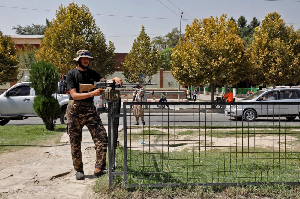 A Taliban fighter stands guard after a blast in front of the Russian embassy in Kabul, Afghanistan, September 5, 2022. Reuters/Ali Khara