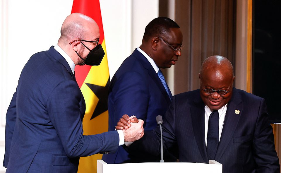 European Council President Charles Michel shakes hands with Ghana's President Nana Afuko Addo, as Senegal's President Macky Sall walks past, after a joint press conference with French President Emmanuel Macron on France's engagement in the Sahel region, at the Elysee Palace, in Paris, on February 17, 2022.  EPA-EFE/IAN LANGSDON/Pool via REUTERS