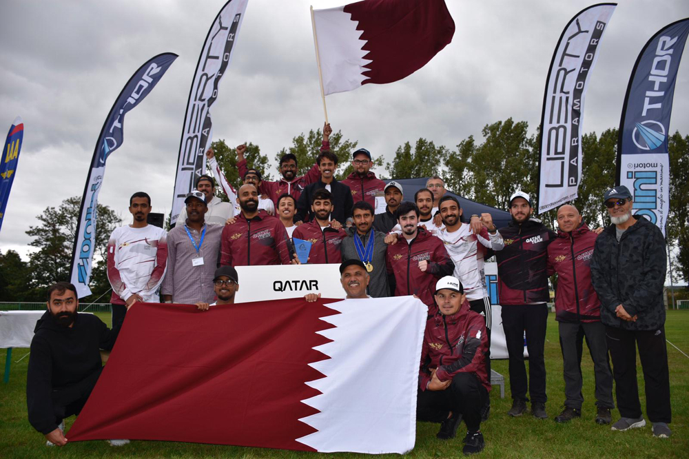 Members of the Qatari Paramotor Team celebrate after winning the Paramotor World Championship (Slalom) in Czech Republic.