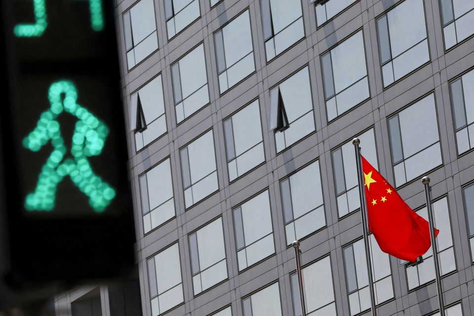 A Chinese national flag flutters outside the China Securities Regulatory Commission (CSRC) building on the Financial Street in Beijing on July 9, 2021. File Photo / Reuters

