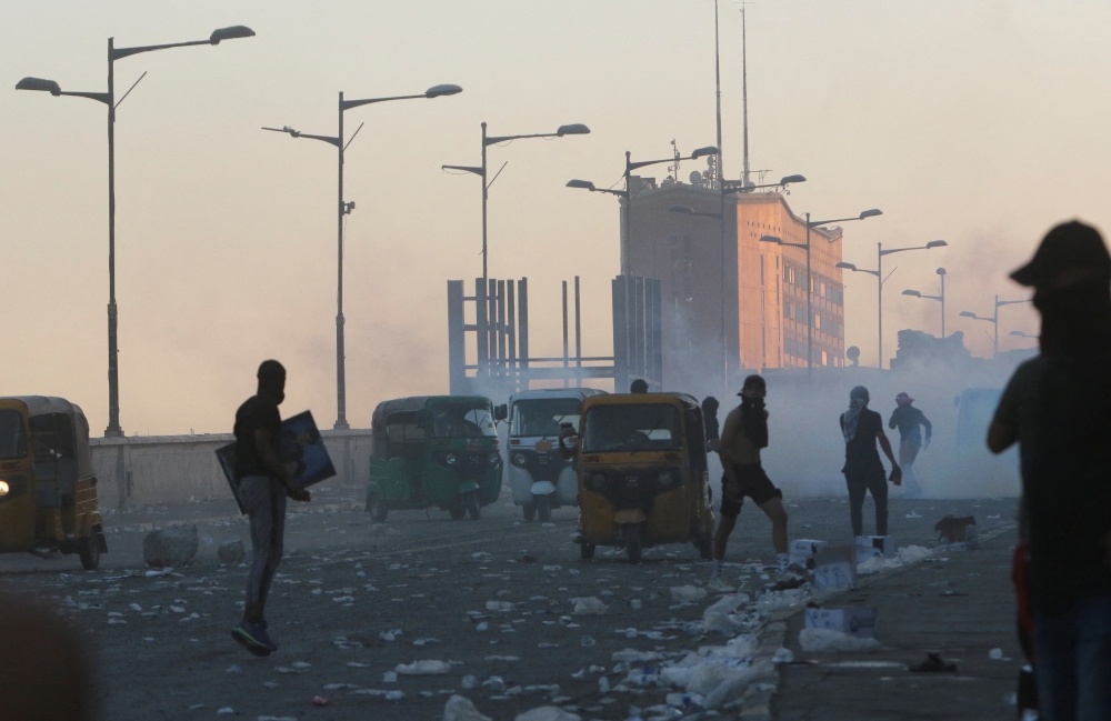 Demonstrators clash with security force during an anti-government protest, after a parliament session, in Baghdad, Iraq, on September 28, 2022. REUTERS/Ahmed Saad