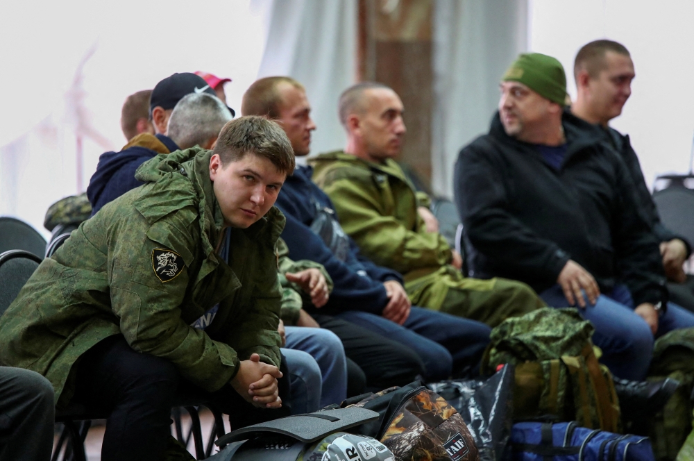 Russian reservists meet at a gathering point in the course of partial mobilization of troops, aimed to support the country's military campaign in Ukraine, in the town of Volzhsky in the Volgograd region, Russia, on September 28, 2022. REUTERS/Stringer