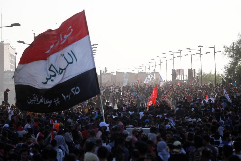 Iraqi protesters gather to mark the third anniversary of the anti-government protests in Baghdad on October 1, 2022. REUTERS/Thaier Al-Sudani
 