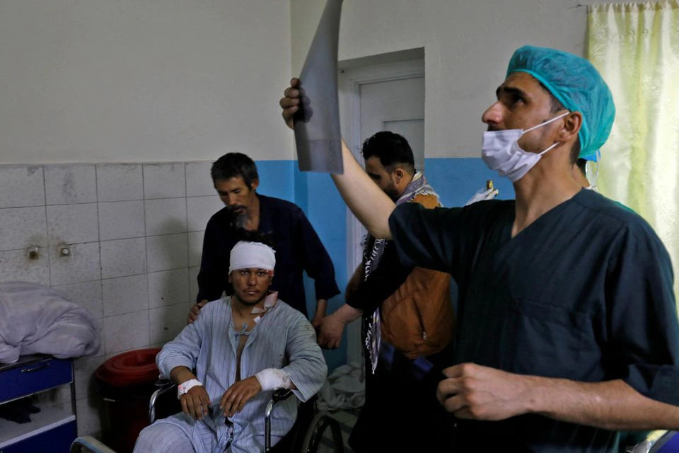 A medic checks an X-ray film of a man who was wounded after a suicide bomber detonated explosives near the entrance of the Russian embassy, inside a hospital in Kabul, Afghanistan, on September 5, 2022. File Photo / Reuters
