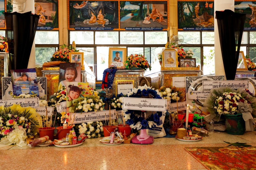 Tributes are placed for the victims at Wat Rat Samakee temple following a mass shooting in the town of Uthai Sawan, Nong Bua Lam Phu province, Thailand October 8, 2022. Reuters/Jorge Silva