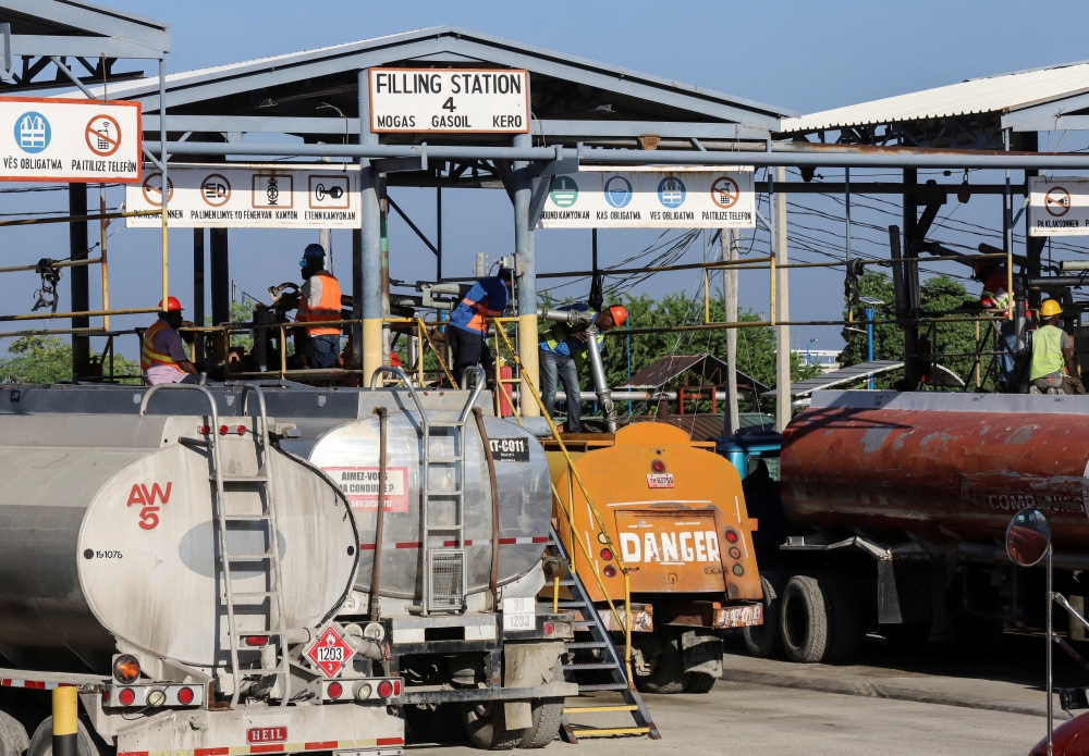 Tanker trucks are being filled with fuel at the Varreux fuel terminal for distribution after a group of Haitian gangs temporarily lifted a blockade leading to shortages, in Port-au-Prince, Haiti November 13, 2021. REUTERS