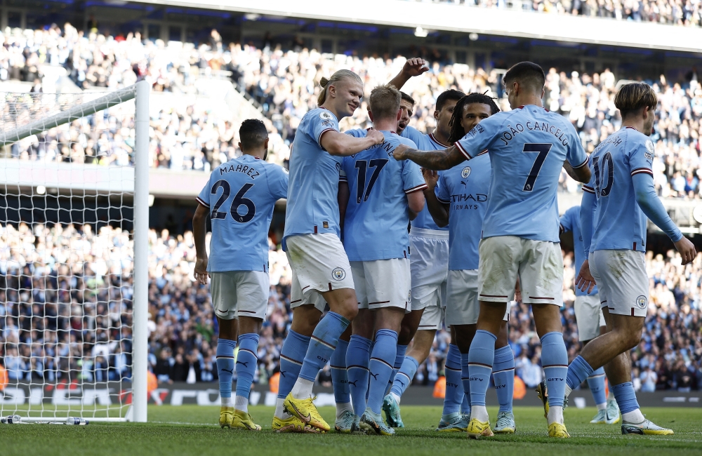 Manchester City players celebrate scoring their fourth goal against Southampton at the Etihad Stadium in Manchester on October 8, 2022.  Action Images via Reuters/Jason Cairnduff 