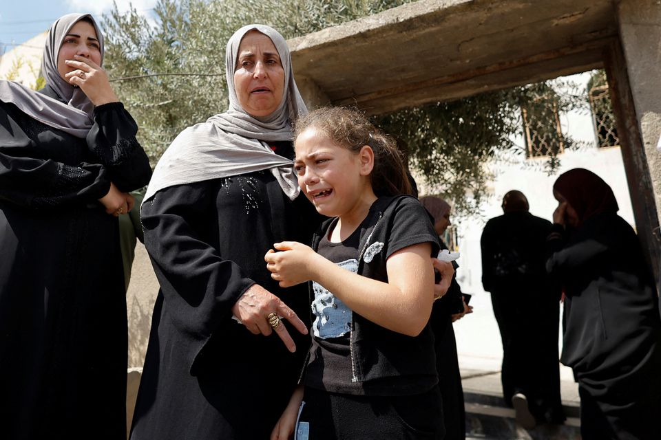 Mourners attend the funeral of Palestinian Mahmoud Al-Sous, who was killed by Israeli forces during clashes in raid, in Jenin in the Israeli-occupied West Bank on October 8, 2022. REUTERS/Raneen Sawafta