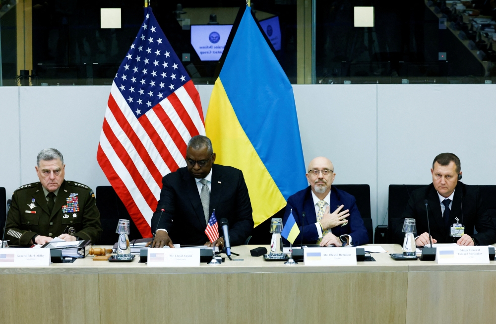 Ukraine's Major General Eduard Moskaliov, Ukraine's Defense Minister Oleksiy Reznikov, US Secretary of Defense Lloyd Austin and US Chairman of the Joint Chiefs of Staff General Mark A. Milley attend a meeting of the Ukraine Defence Contact Group during a NATO defence ministers meeting at the Alliance's headquarters in Brussels, Belgium, on October 12, 2022. REUTERS/Yves Herman