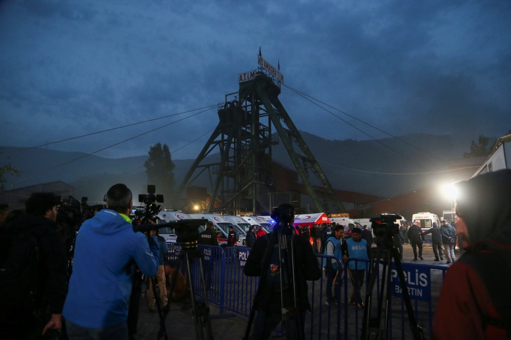 Media members report outside the coal mine as search and rescue operation continues after an explosion, in Amasra in the northern Bartin province.